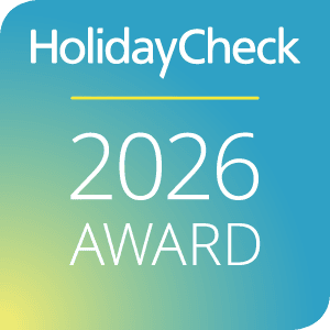 HolidayCheck 2026 Award Logo on Color Gradient