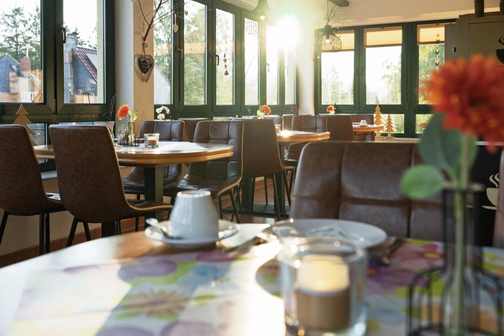Bright restaurant with tables and flowers