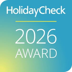 HolidayCheck 2026 Award Logo auf Farbverlauf