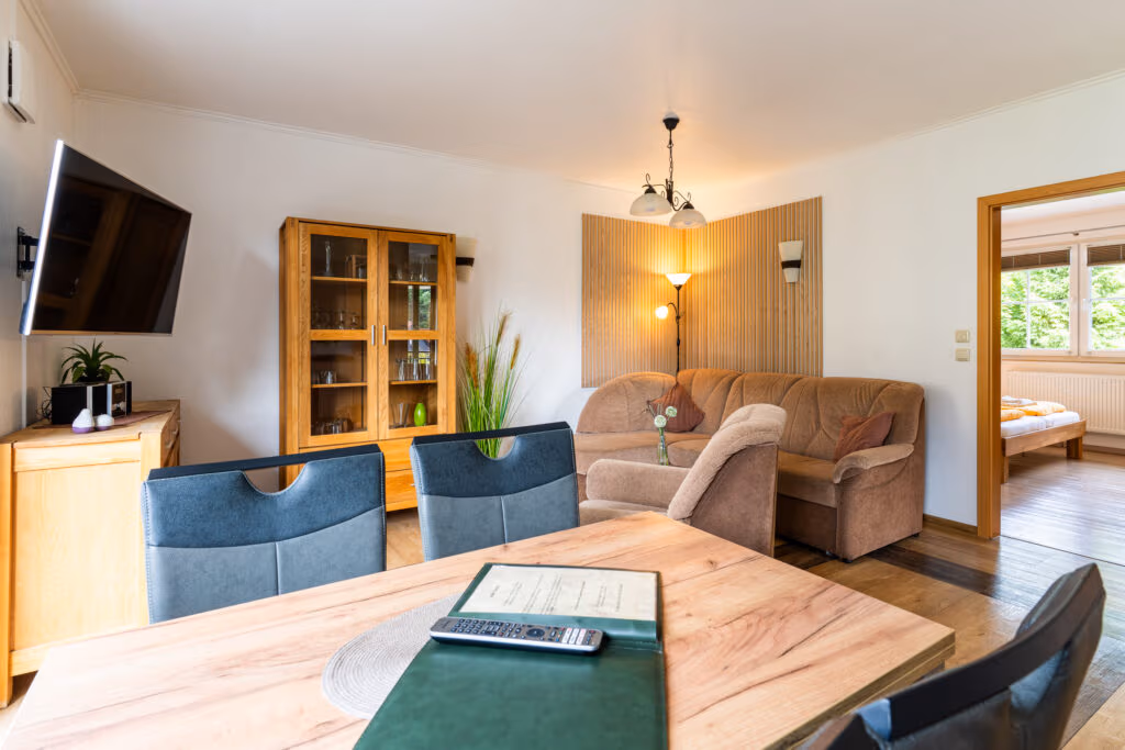 Cozy living and dining room with wooden furniture